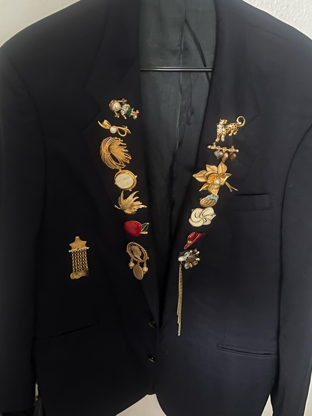 Black Blazer with Decorative Gold Accents with all high end designer brooches